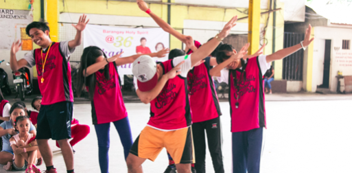 Hygiene Ambassadors in Philippines demonstrating how to sneeze properly. Photo Credit: Tracy Wong